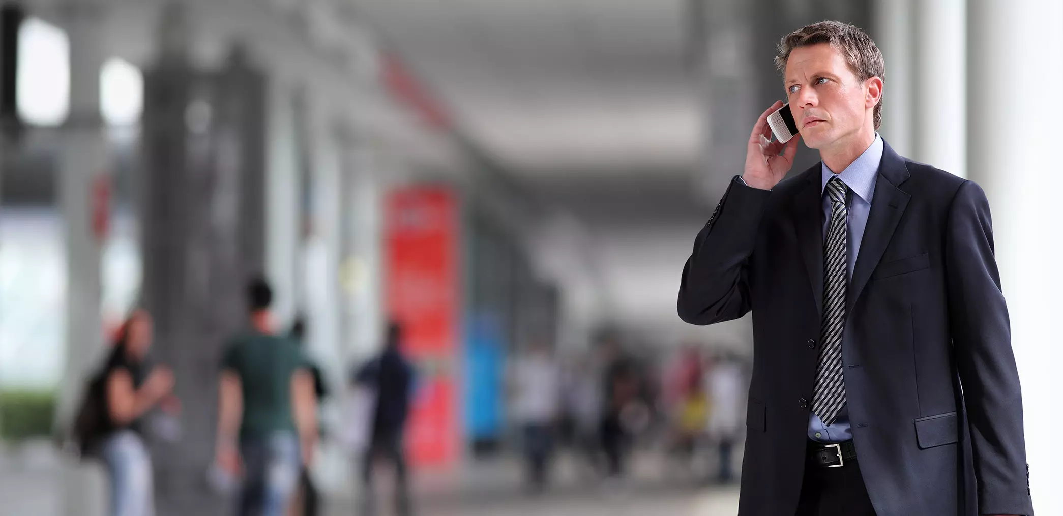 man on phone at tradeshow